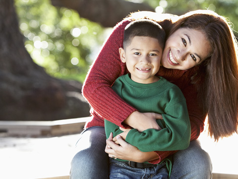 Mother hugging son