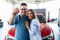 Couple Standing in front of Car