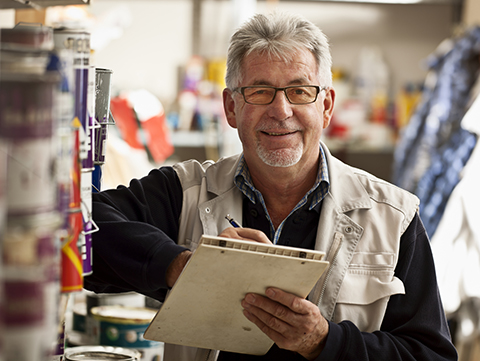 Man holding clipboard in hardware store