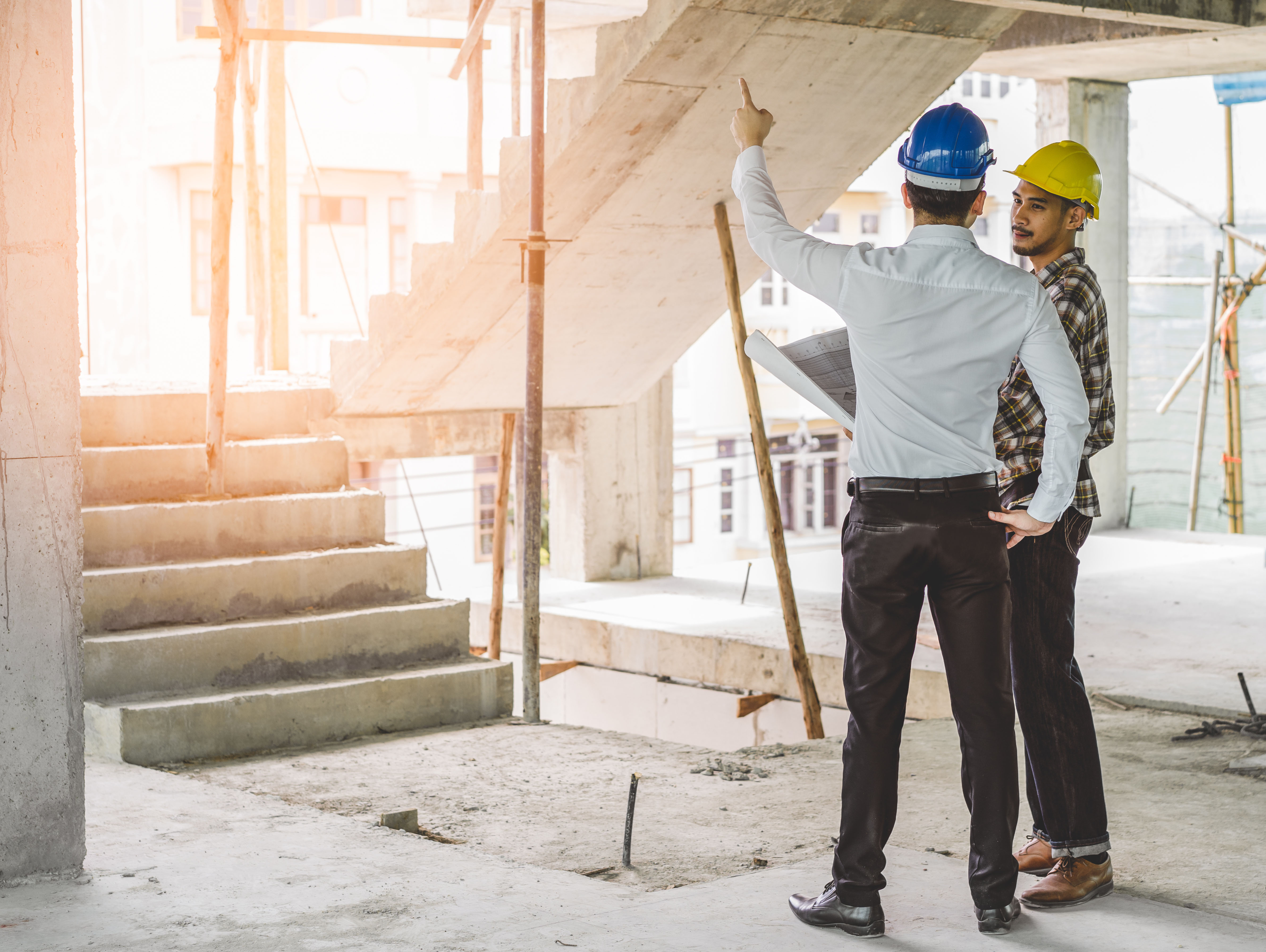 Construction workers talking on job site