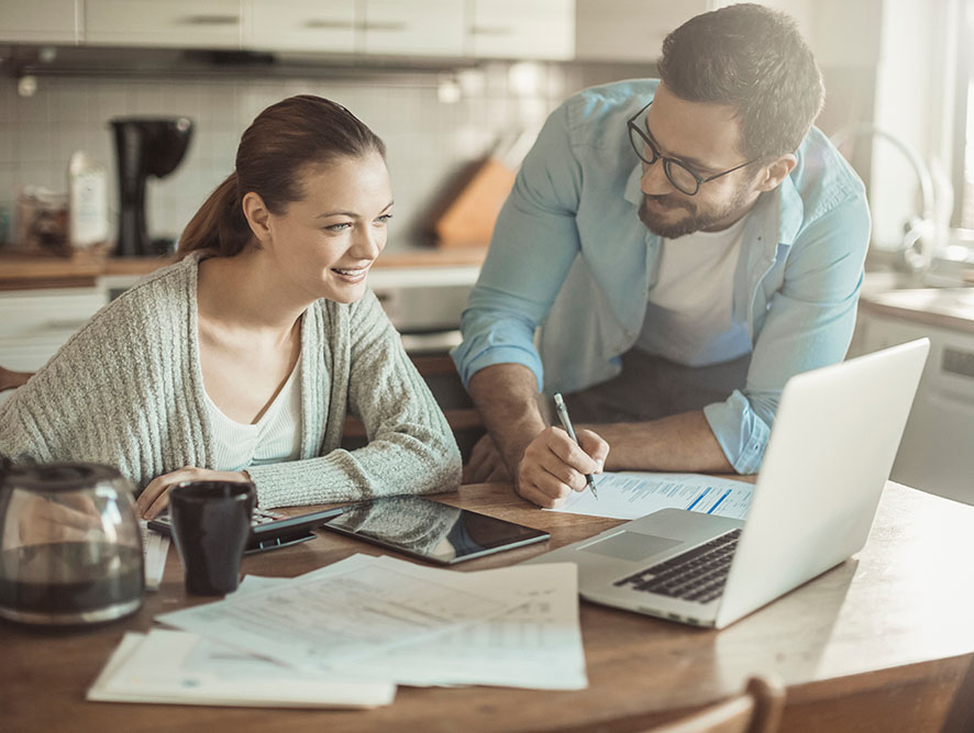 Young couple looking at laptop